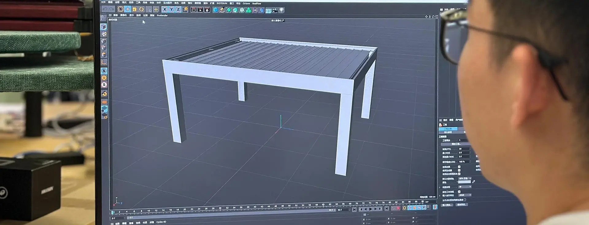 Designer using 3D modeling software to create a digital prototype of a pergola on a monitor