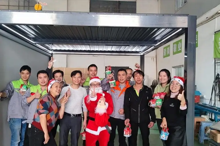 Employees celebrating Christmas in a warm pergola team gathering that reflects care and social responsibility