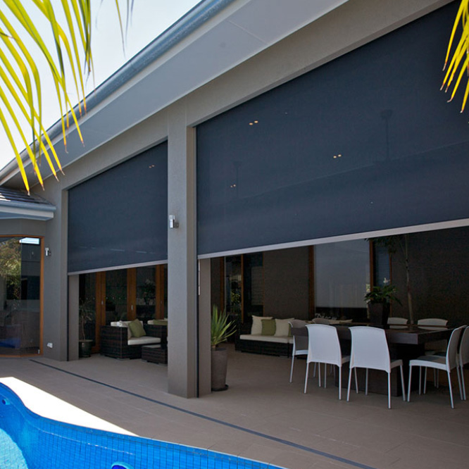 Motorized Zip Track Zipblind outdoor shade screens over modern home patio dining space